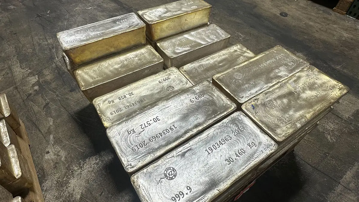 Stacked 1,000 oz silver bullion bars stamped with serial numbers and .999 fineness