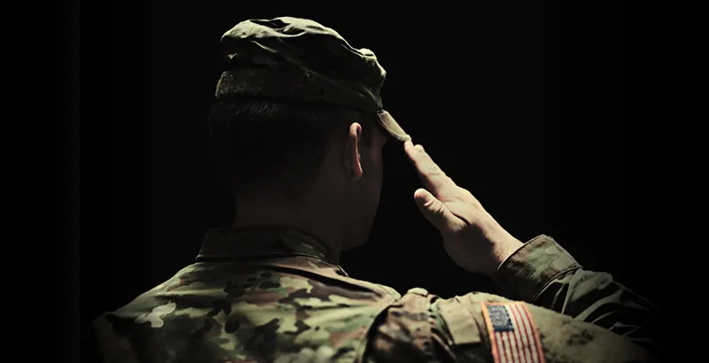 Service member reviewing gold and silver holdings