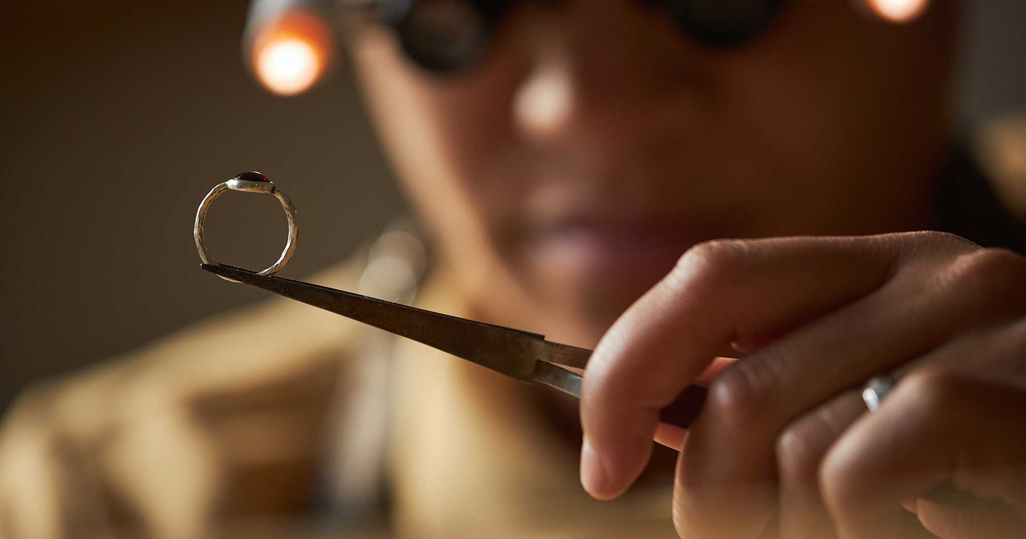 man examining gold ring