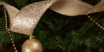 Christmas tree decorations with golden ribbon and beads